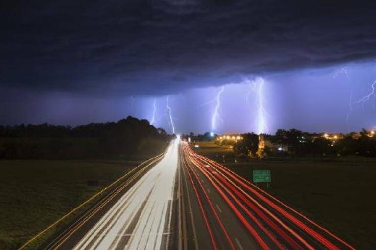 Storm and lightning over highway