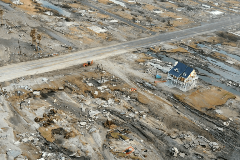 An aerial view of a destroyed house.
